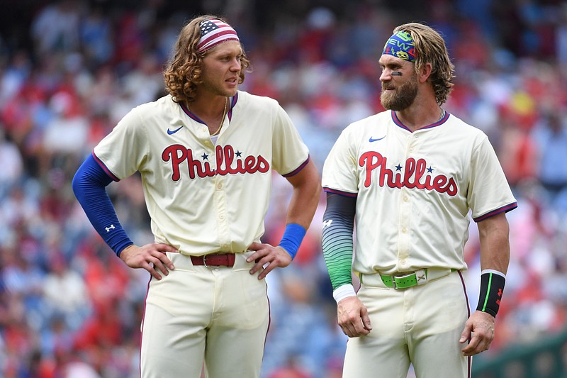 Jul 14, 2024; Philadelphia, Pennsylvania, USA; Philadelphia Phillies third baseman Alec Bohm (28) and  first baseman Bryce Harper (3) in between innings against the Oakland Athletics at Citizens Bank Park. Mandatory Credit: Eric Hartline-USA TODAY Sports