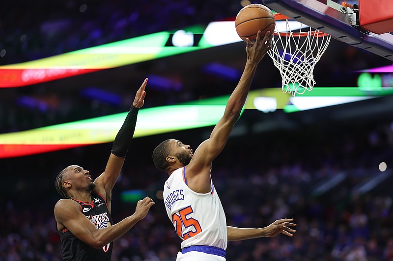 Jan 24, 2026; Philadelphia, Pennsylvania, USA; New York Knicks guard Mikal Bridges (25) drives for a score in front of Philadelphia 76ers guard Tyrese Maxey (0) during the first quarter at Xfinity Mobile Arena. Mandatory Credit: Bill Streicher-Imagn Images