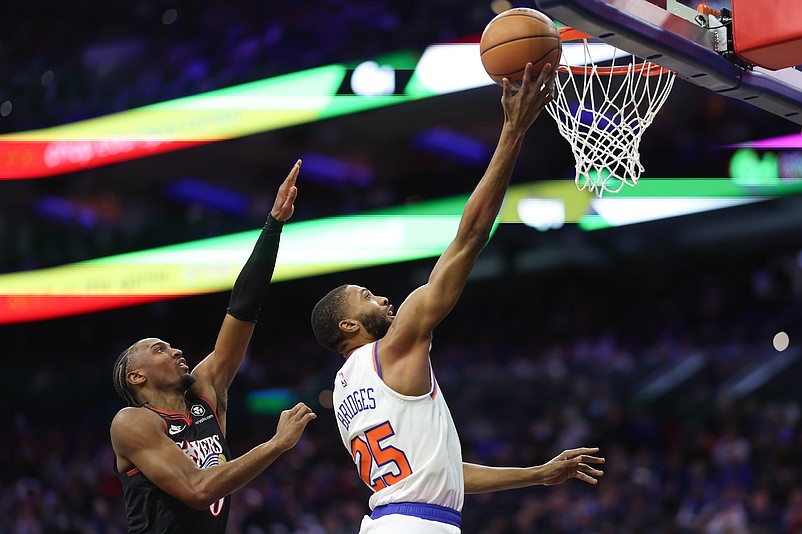 Jan 24, 2026; Philadelphia, Pennsylvania, USA; New York Knicks guard Mikal Bridges (25) drives for a score in front of Philadelphia 76ers guard Tyrese Maxey (0) during the first quarter at Xfinity Mobile Arena. Mandatory Credit: Bill Streicher-Imagn Images