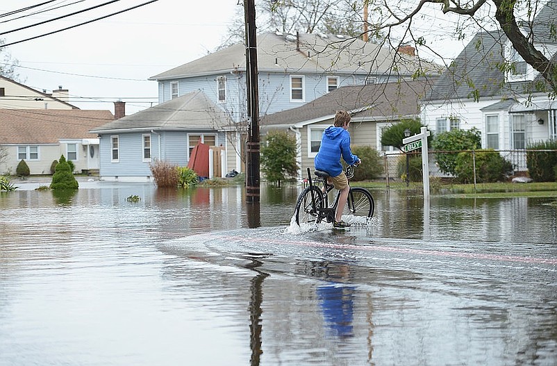 Environmentalists cheer the new flood rules as a needed move to guard against climate impacts, while businesses believe they will raise construction costs. (Photo by Michael Loccisano/Getty Images)