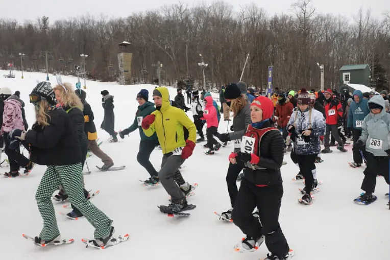 Roughly 350 racers begin Spring Mountain’s annual 5K Snowshoe race.