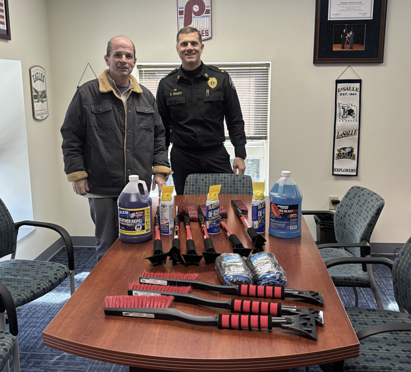 Ed Lain, left, donated car care kits to the Marple Township Police Department, ahead of the winter storm. Here, Police Chief Brandon Graeff, right, thanks the thoughtful resident for his kind donation. (Image courtesy of MTPD)