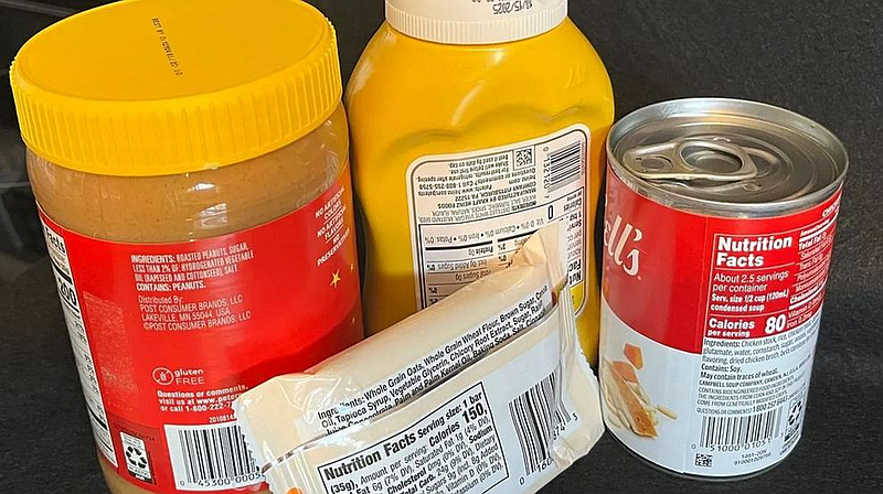 A selection of packaged food products displays nutrition labels and ingredient information. (Credit: Alan Wooten / The Center Square)