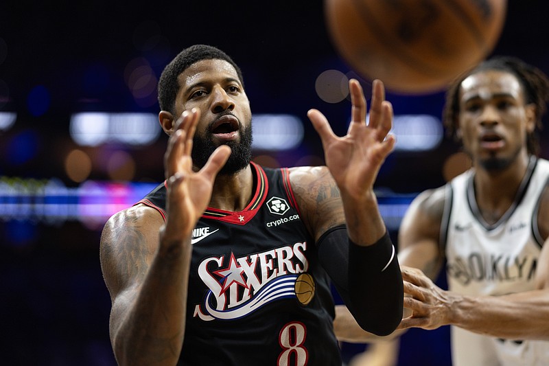 Dec 23, 2025; Philadelphia, Pennsylvania, USA; Philadelphia 76ers forward Paul George (8) catches a pass against the Brooklyn Nets during the third quarter at Xfinity Mobile Arena. Mandatory Credit: Bill Streicher-Imagn Images