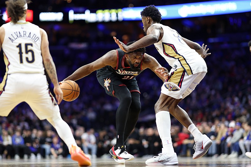 Jan 31, 2026; Philadelphia, Pennsylvania, USA; Philadelphia 76ers center Joel Embiid (21) dribbles the ball against New Orleans Pelicans center Yves Missi (21) during the fourth quarter at Xfinity Mobile Arena. Mandatory Credit: Bill Streicher-Imagn Images