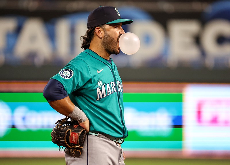 Sep 16, 2025; Kansas City, Missouri, USA; Seattle Mariners third baseman Eugenio Suarez (28) blows a bubble during a break in action in the bottom of the eighth inning against the Kansas City Royals at Kauffman Stadium. Mandatory Credit: Scott Sewell-Imagn Images