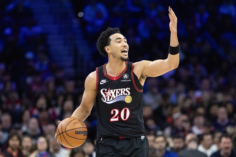 Dec 23, 2025; Philadelphia, Pennsylvania, USA; Philadelphia 76ers guard Jared McCain (20) controls the ball against the Brooklyn Nets during the third quarter at Xfinity Mobile Arena. Mandatory Credit: Bill Streicher-Imagn Images