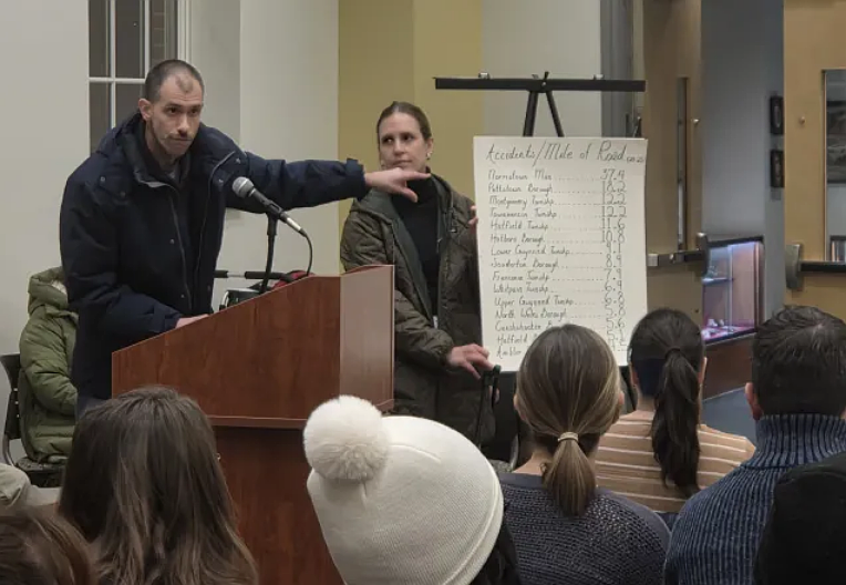 Lansdale residents Rob and Marianna Kirkner of Perkiomen Avenue show a chart of accidents per mile of roadway from 2020 to 2025 in several local towns, during the Lansdale public safety committee meeting on Wednesday, Feb. 4, 2026.
