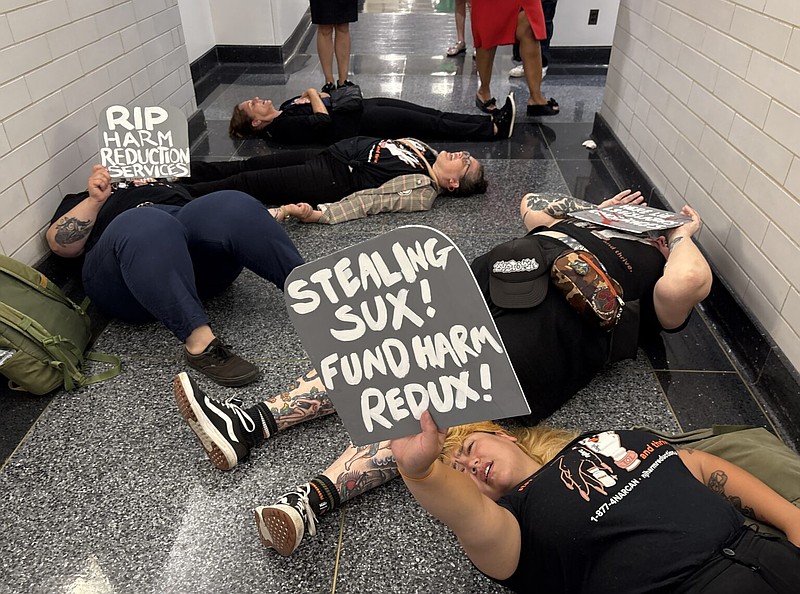 Harm reduction advocates staged a die-in at the Trenton Statehouse on Monday, June 30, 2025, after legislators — fearing federal Medicaid cuts would hurt hospitals — decided to divert $45 million in national opioid settlement funds to four of the state’s largest hospitals. (Photo by Dana DiFilippo/New Jersey Monitor)