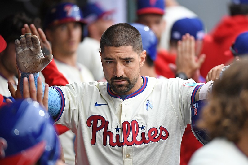 Jun 15, 2025; Philadelphia, Pennsylvania, USA; Philadelphia Phillies outfielder Nick Castellanos (8) celebrates his grand slam home run in the dugout during the sixth inning against the Toronto Blue Jays at Citizens Bank Park. Mandatory Credit: Eric Hartline-Imagn Images
