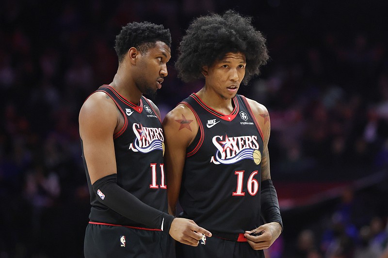Feb 11, 2026; Philadelphia, Pennsylvania, USA; Philadelphia 76ers forward Justin Edwards (11) and forward Marjon Beauchamp (16) talk during a timeout in the second half against the New York Knicks at Xfinity Mobile Arena. Mandatory Credit: Bill Streicher-Imagn Images