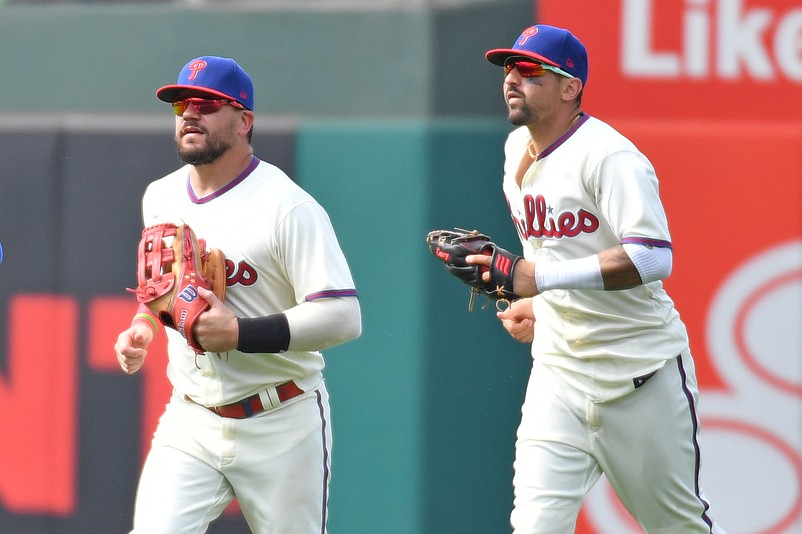 Aug 6, 2023; Philadelphia, Pennsylvania, USA; Philadelphia Phillies left fielder Kyle Schwarber (12) and right fielder Nick Castellanos (8) celebrate win against the Kansas City Royals at Citizens Bank Park. Mandatory Credit: Eric Hartline-USA TODAY Sports