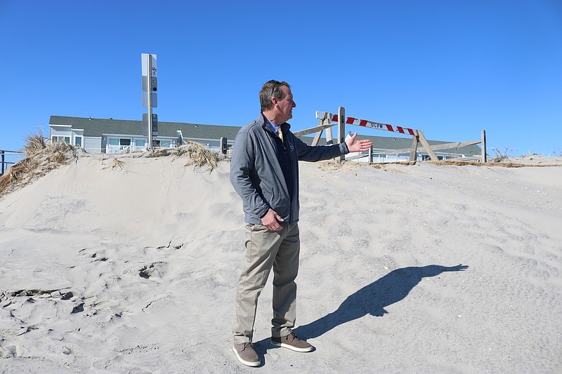 Mayor Jay Gillian points out storm damage on the 5th Street beach in Ocean City's north end.