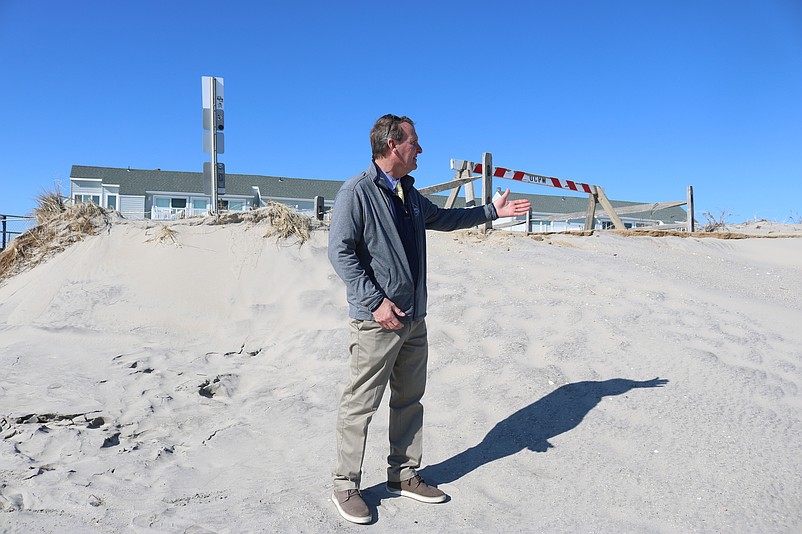 Mayor Jay Gillian points out storm damage on the 5th Street beach in Ocean City's north end.