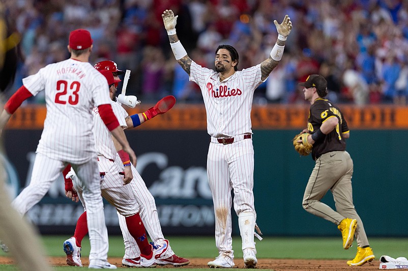 Jun 18, 2024; Philadelphia, Pennsylvania, USA; Philadelphia Phillies outfielder Nick Castellanos (8) celebrates with his team after hitting a game winning RBI double during the ninth inning against the San Diego Padres at Citizens Bank Park. Mandatory Credit: Bill Streicher-USA TODAY Sports