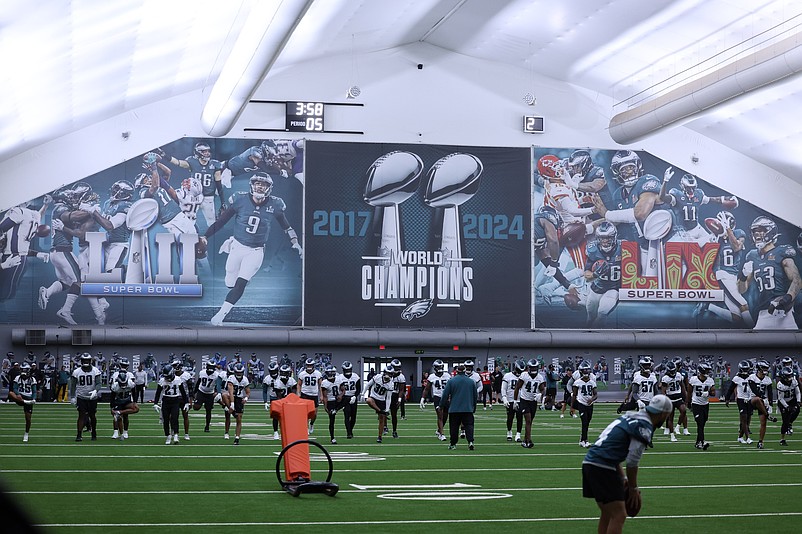 May 28, 2025; Philadelphia, PA, USA; General view as the Philadelphia Eagles warm up in the practice indoors during OTAs at NovaCare Complex. Mandatory Credit: Bill Streicher-Imagn Images