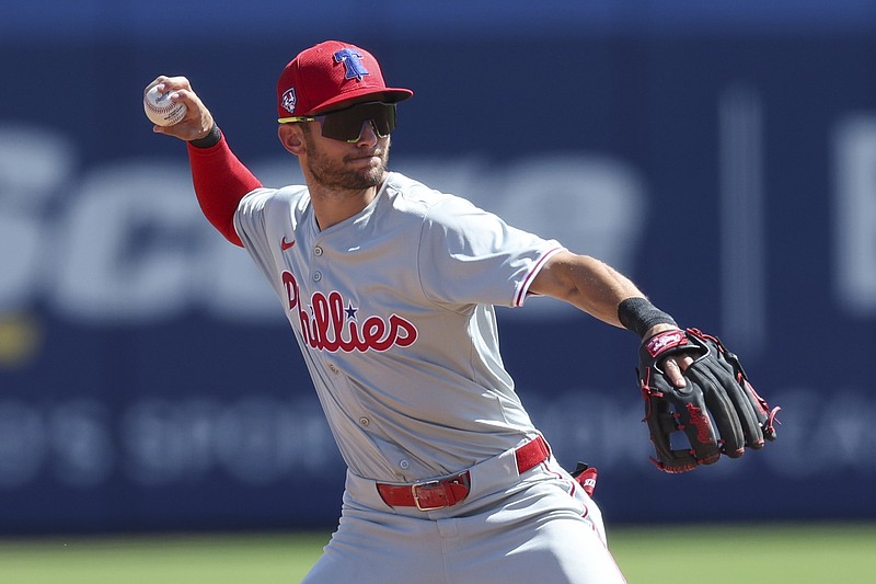 Mar 4, 2024; Dunedin, Florida, USA;  Philadelphia Phillies shortstop Trea Turner (7) throws to first for an out against the Toronto Blue Jays in the second inning at TD Ballpark. Mandatory Credit: Nathan Ray Seebeck-USA TODAY Sports