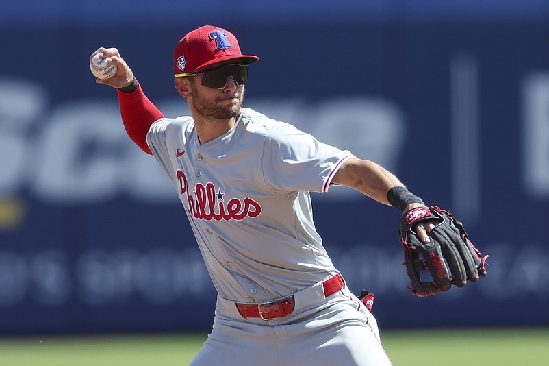 Mar 4, 2024; Dunedin, Florida, USA;  Philadelphia Phillies shortstop Trea Turner (7) throws to first for an out against the Toronto Blue Jays in the second inning at TD Ballpark. Mandatory Credit: Nathan Ray Seebeck-USA TODAY Sports
