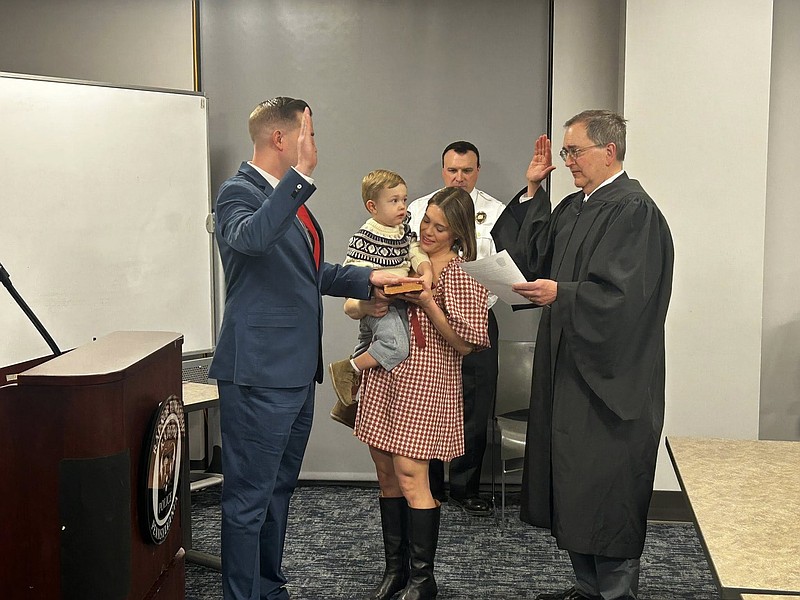 Officer Ward, left, is pictured with his wife, Christina, and their two-year-old son during the recent swearing in. (Image courtesy of RTPD)
