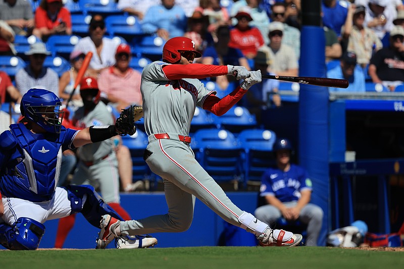 Feb 21, 2026; Dunedin, Florida, USA;  Philadelphia Phillies outfielder Justin Crawford (80) doubles during the first inning at TD Ballpark. Mandatory Credit: Kim Klement Neitzel-Imagn Images