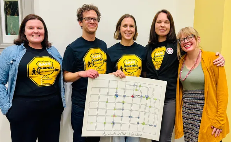 Lansdale residents Karalyn Derstine, Sheldon Good, Marianna Kirkner, Shannon DeBellis, and Mayor Rachael Bollens pose with ‘SAFE Guards of Lansdale’ shirts and a map of recent accidents in the west ward of the borough, during the Feb. 18, 2026 council meeting. (Photo courtesy of Sheldon Good)