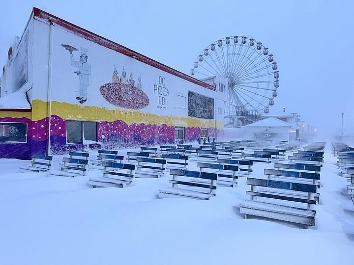The Ocean City Boardwalk is blanketed in snow next to the former Wonderland Pier amusement park and its towering Ferris wheel. (Photo courtesy of Robin Shaffer)