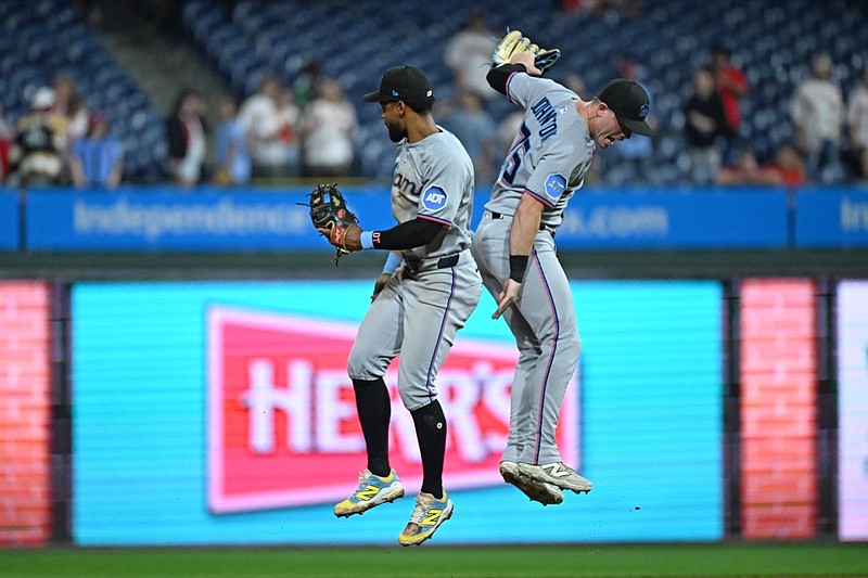 Sep 23, 2025; Philadelphia, Pennsylvania, USA; Miami Marlins second base Otto Lopez (6) and outfield Troy Johnston (75) celebrate win against the Philadelphia Phillies at Citizens Bank Park. Mandatory Credit: Eric Hartline-Imagn Images