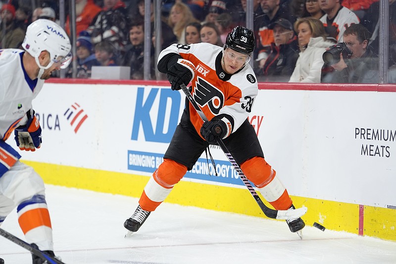 Jan 26, 2026; Philadelphia, Pennsylvania, USA; Philadelphia Flyers right wing Matvei Michkov (39) passes the puck against the New York Islanders in the first period at Xfinity Mobile Arena. Mandatory Credit: Kyle Ross-Imagn Images