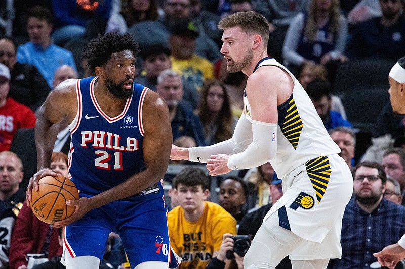 Feb 24, 2026; Indianapolis, Indiana, USA;  Philadelphia 76ers center/forward Joel Embiid (21) holds the ball while  Indiana Pacers center Micah Potter (11) defends in the first half at Gainbridge Fieldhouse. Mandatory Credit: Trevor Ruszkowski-Imagn Images