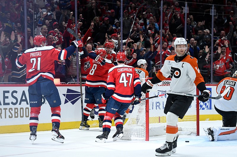 Feb 25, 2026; Washington, District of Columbia, USA; Washington Capitals defenseman Trevor van Riemsdyk (57) celebrates with left wing Alex Ovechkin (8) after scoring a goal as Philadelphia Flyers center Sean Couturier (14) reacts during the third period at Capital One Arena. Mandatory Credit: Hannah Foslien-Imagn Images