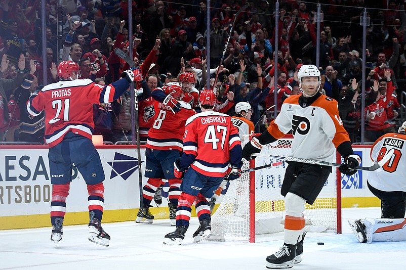 Feb 25, 2026; Washington, District of Columbia, USA; Washington Capitals defenseman Trevor van Riemsdyk (57) celebrates with left wing Alex Ovechkin (8) after scoring a goal as Philadelphia Flyers center Sean Couturier (14) reacts during the third period at Capital One Arena. Mandatory Credit: Hannah Foslien-Imagn Images