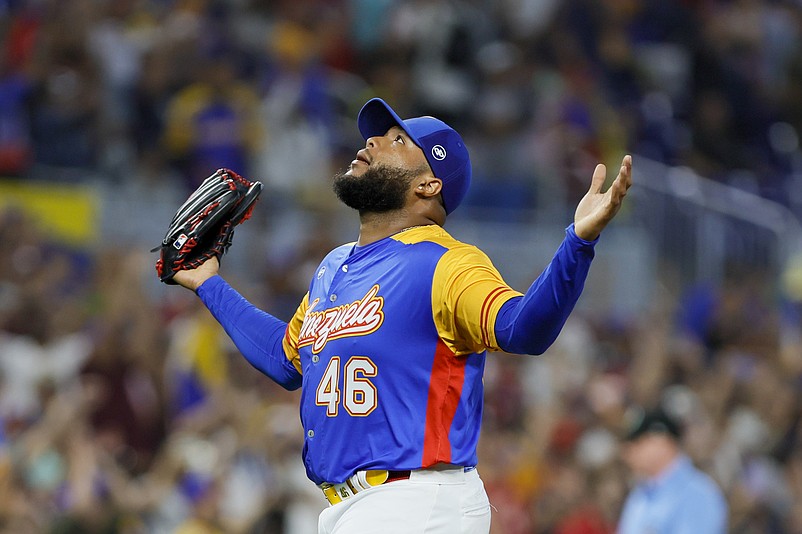Mar 14, 2023; Miami, Florida, USA; Venezuela relief pitcher Jose Alvarado (46) reacts after winning the game against Nicaragua at LoanDepot Park. Mandatory Credit: Sam Navarro-USA TODAY Sports
