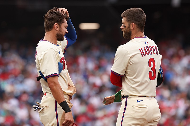 Aug 20, 2025; Philadelphia, Pennsylvania, USA; Philadelphia Phillies shortstop Trea Turner (7) and first base Bryce Harper (3) talks during a Seattle Mariners pitching change during the sixth inning at Citizens Bank Park. Mandatory Credit: Bill Streicher-Imagn Images
