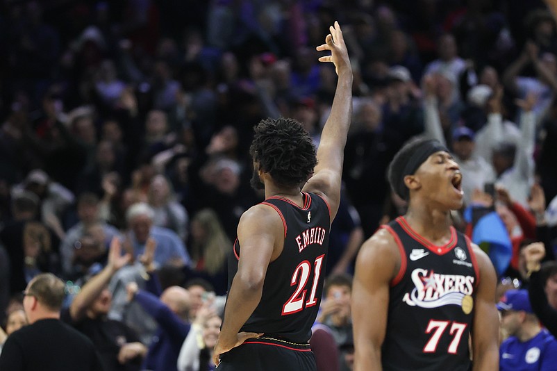 Feb 26, 2026; Philadelphia, Pennsylvania, USA; Philadelphia 76ers center Joel Embiid (21) reacts to his three pointer against the Miami Heat during the fourth quarter at Xfinity Mobile Arena. Mandatory Credit: Bill Streicher-Imagn Images