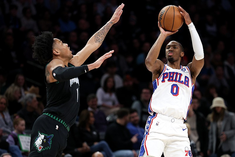 Feb 22, 2026; Minneapolis, Minnesota, USA; Philadelphia 76ers guard Tyrese Maxey (0) shoots over Minnesota Timberwolves guard Terrence Shannon Jr. (1) during the first half at Target Center. Mandatory Credit: Matt Krohn-Imagn Images