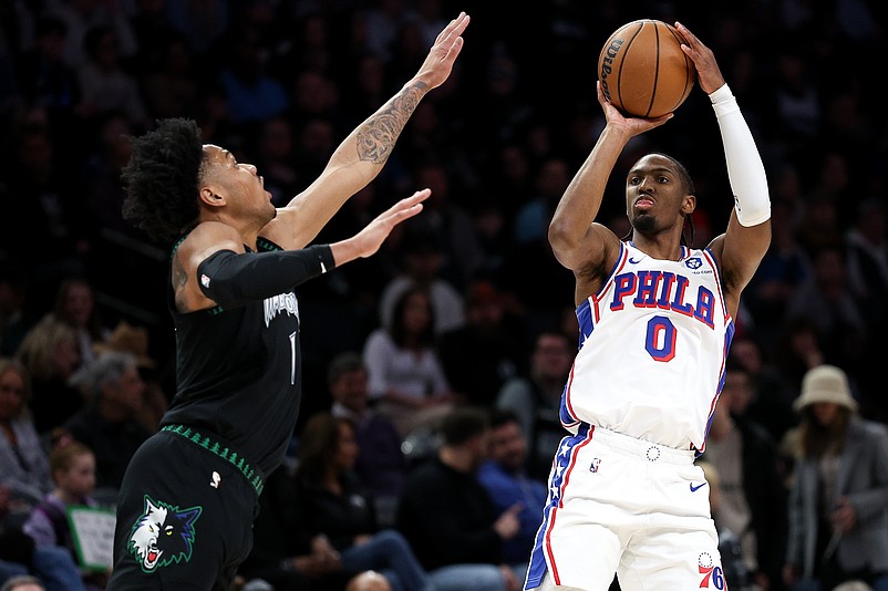Feb 22, 2026; Minneapolis, Minnesota, USA; Philadelphia 76ers guard Tyrese Maxey (0) shoots over Minnesota Timberwolves guard Terrence Shannon Jr. (1) during the first half at Target Center. Mandatory Credit: Matt Krohn-Imagn Images