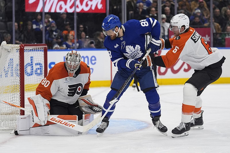 Mar 2, 2026; Toronto, Ontario, CAN; Toronto Maple Leafs forward William Nylander (88) tries to deflect a shot past Philadelphia Flyers goaltender Dan Vladar (80) as  defenseman Travis Sanheim (6) helps defend during the third period at Scotiabank Arena. Mandatory Credit: John E. Sokolowski-Imagn Images