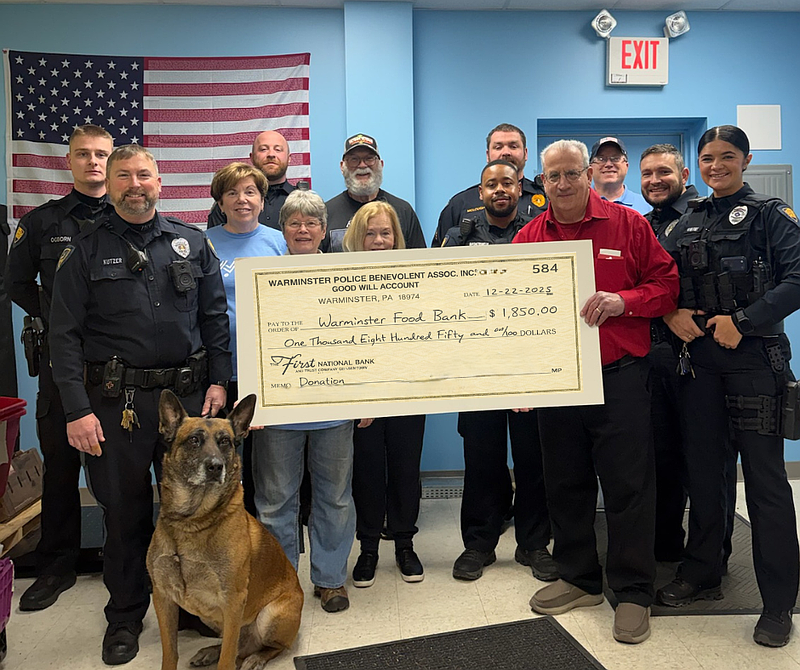 Members of the Warminster Police Benevolent Association (PBA), as well as staff members and volunteers from Warminster Food Bank pose with a donation check (Credit: Warminster Food Bank)