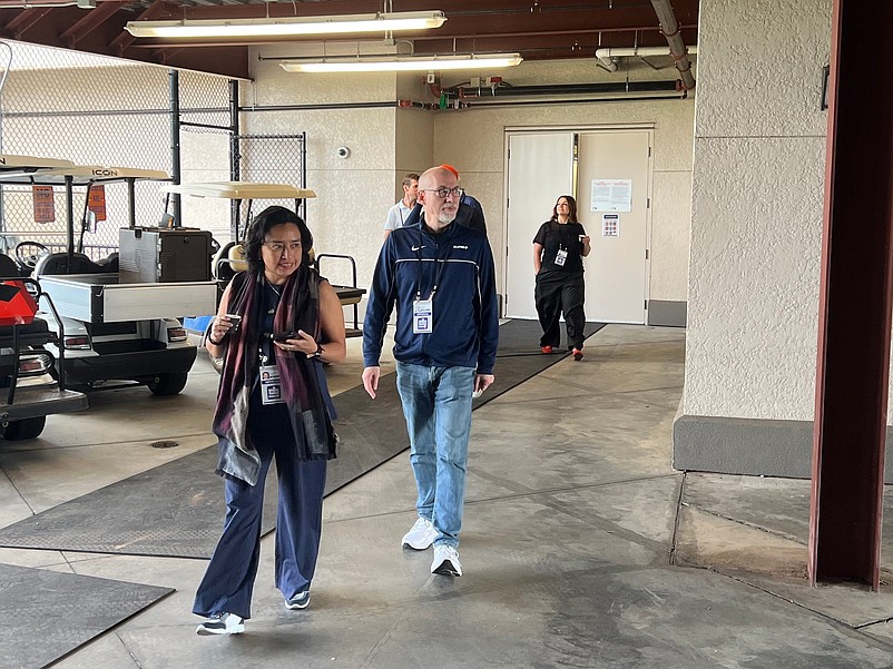 MLB Players Association interim executive director Bruce Meyer (middle) walks alongside MLBPA associate director Silvia Alvarez (left) after meeting with the Detroit Tigers during spring training at Joker Marchant Stadium in Lakeland, Florida.