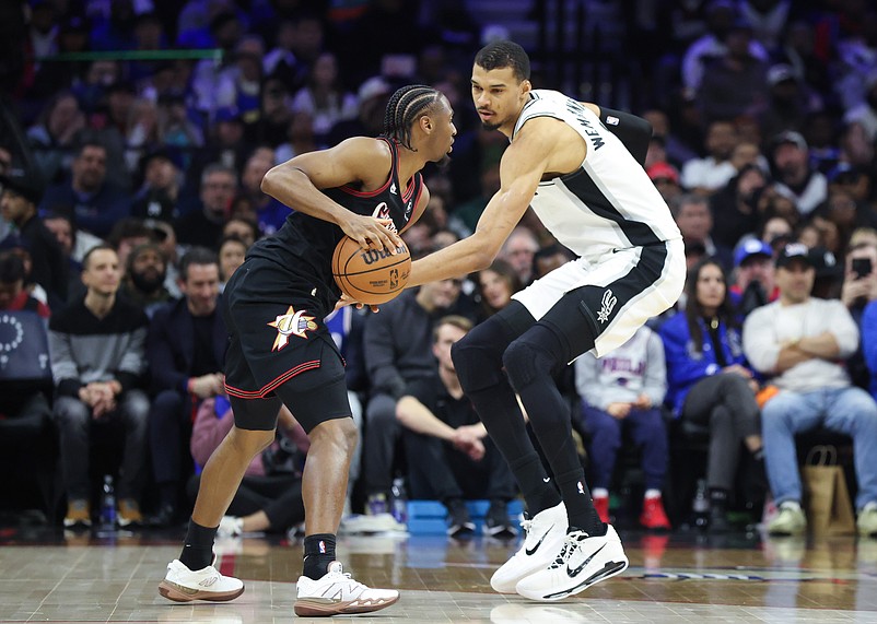 Mar 3, 2026; Philadelphia, Pennsylvania, USA; Philadelphia 76ers guard Tyrese Maxey (0) controls the ball in front of San Antonio Spurs forward Victor Wembanyama (1) during the second quarter at Xfinity Mobile Arena. Mandatory Credit: Bill Streicher-Imagn Images