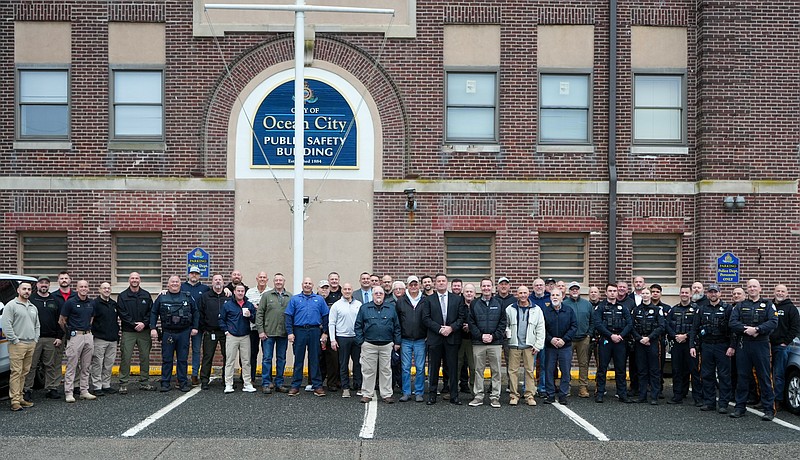 Police and city officials stand outside the old public safety building to mark its closing. (Photo courtesy of Ocean City)