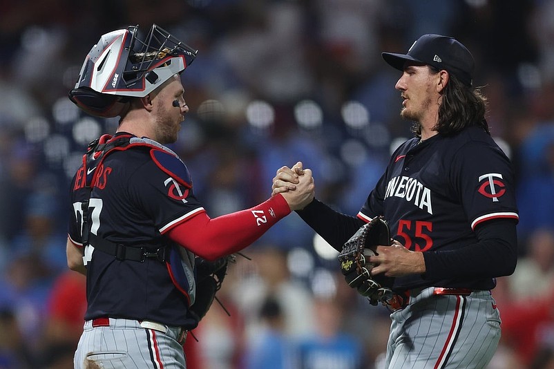 Sep 27, 2025; Philadelphia, Pennsylvania, USA; Minnesota Twins pitcher Kody Funderburk (55) and catcher Ryan Jeffers (27) shake hands after a win against the Philadelphia Phillies at Citizens Bank Park. Mandatory Credit: Bill Streicher-Imagn Images