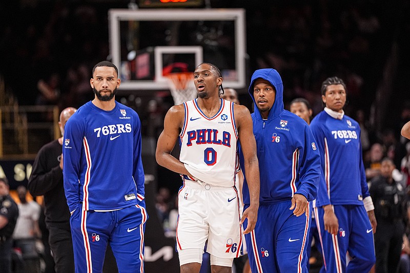 Mar 7, 2026; Atlanta, Georgia, USA; Philadelphia 76ers guard Tyrese Maxey (0) reacts and is assisted after being injured against the Atlanta Hawks during the second half at State Farm Arena. Mandatory Credit: Dale Zanine-Imagn Images