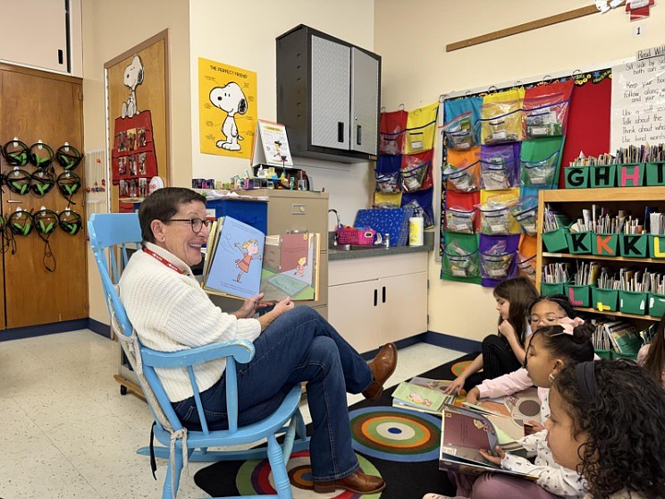 Kathleen Woodring, a member of the Friends and Volunteers group at the Ocean City Free Public Library, reads to students at Ocean City Primary School, where she used to teach. (Photo courtesy of Ocean City school district)
