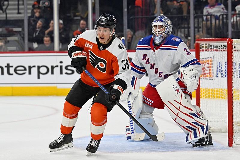 Mar 9, 2026; Philadelphia, Pennsylvania, USA; Philadelphia Flyers right wing Matvei Michkov (39) and New York Rangers goaltender Igor Shesterkin (31) battle for position during the first period at Xfinity Mobile Arena. Mandatory Credit: Eric Hartline-Imagn Images