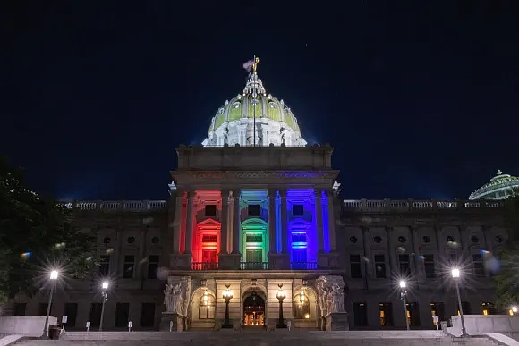 The PA Capitol lit up for LGBTQ Pride Month in June 2022. (Credit: LevittownNow)