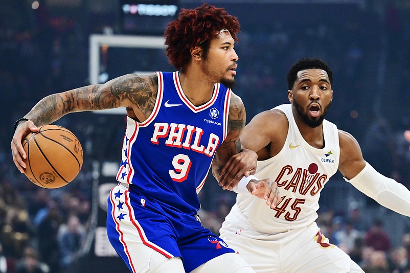 Mar 9, 2026; Cleveland, Ohio, USA; Philadelphia 76ers guard Kelly Oubre Jr. (9) drives to the basket against Cleveland Cavaliers guard Donovan Mitchell (45) during the first quarter at Rocket Arena. Mandatory Credit: Ken Blaze-Imagn Images