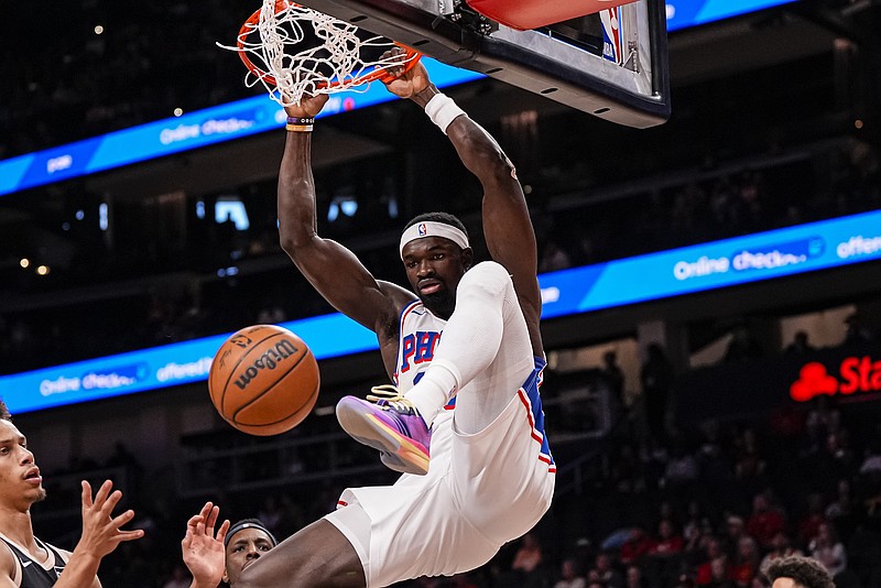 Mar 7, 2026; Atlanta, Georgia, USA; Philadelphia 76ers forward Adem Bona (30) dunks against the Atlanta Hawks during the first half at State Farm Arena. Mandatory Credit: Dale Zanine-Imagn Images
