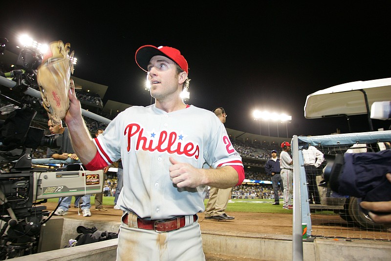 October 15, 2008; Los Angeles, CA, USA; Philadelphia Phillies second baseman Chase Utley (26) acknowledges fans as he goes to the clubhouse to celebrate the Phillies 5-1 win against the Los Angeles Dodgers during game five of the NLCS at Dodger Stadium. The Phillies win the series 4 games to 1 and advance to the World Series.Mandatory Credit: Gary A. Vasquez-USA TODAY Sports .