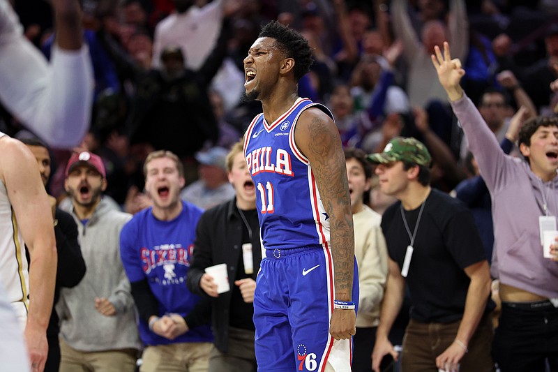 Nov 11, 2025; Philadelphia, Pennsylvania, USA; Philadelphia 76ers forward Justin Edwards (11) reacts after his three pointer during the fourth quarter against the Boston Celtics at Xfinity Mobile Arena. Mandatory Credit: Bill Streicher-Imagn Images